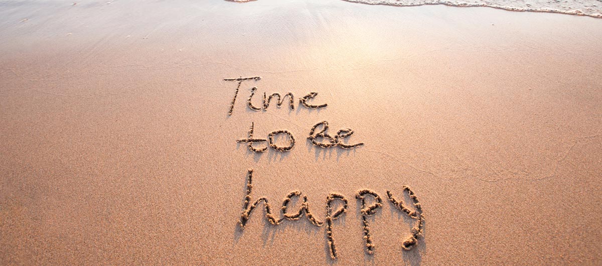 Time to be Happy written in sand